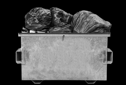 Man and van team loading a Luton-style vehicle for commercial clearance