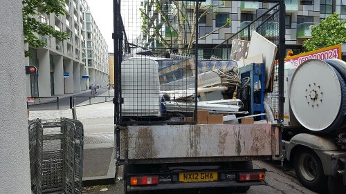 Truck transporting builders waste away from a building site